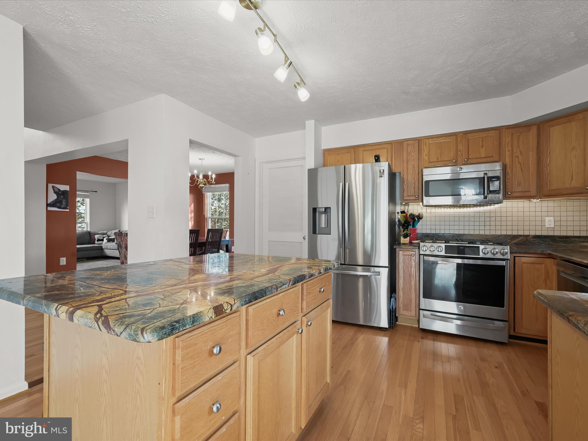 2333 Golden Chapel Road Odenton, MD 21113 - Photo 14 of 62 a kitchen with stainless steel appliances granite countertop a refrigerator a stove and a sink