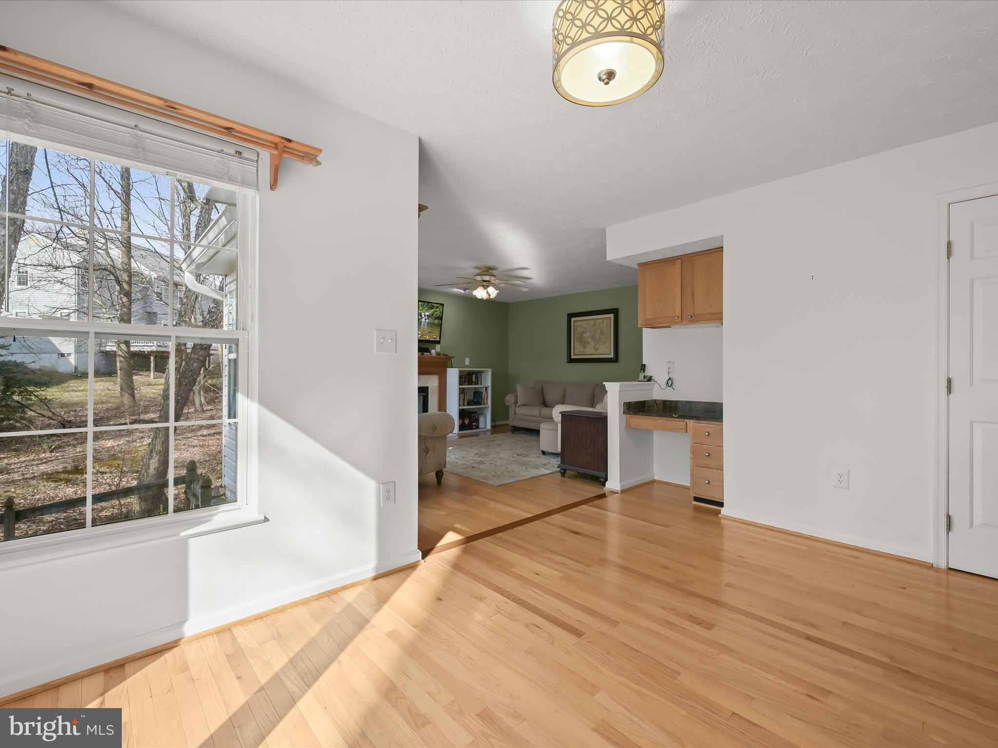 2333 Golden Chapel Road Odenton, MD 21113 - Photo 18 of 62 a view of a kitchen with wooden floor and windows
