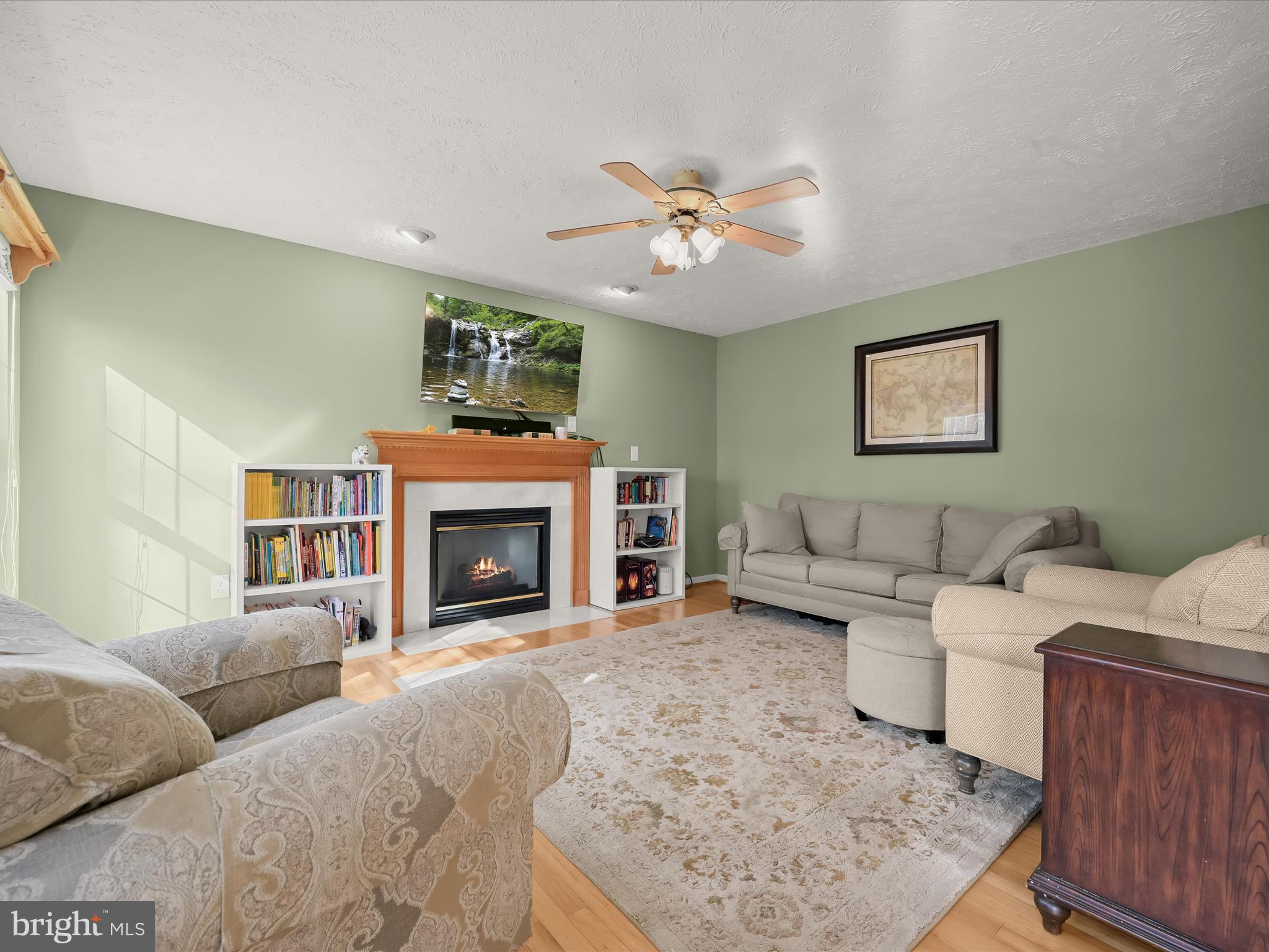 2333 Golden Chapel Road Odenton, MD 21113 - Photo 21 of 62 a living room with furniture and a fireplace