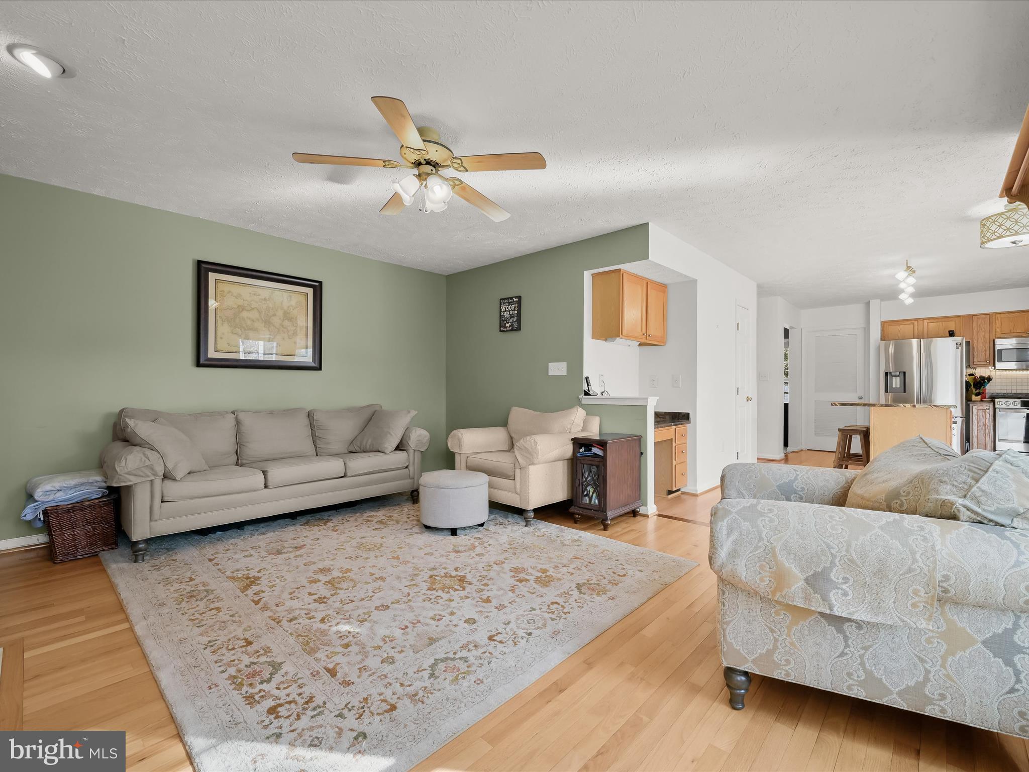 2333 Golden Chapel Road Odenton, MD 21113 - Photo 22 of 62 a living room with furniture and painting on the wall