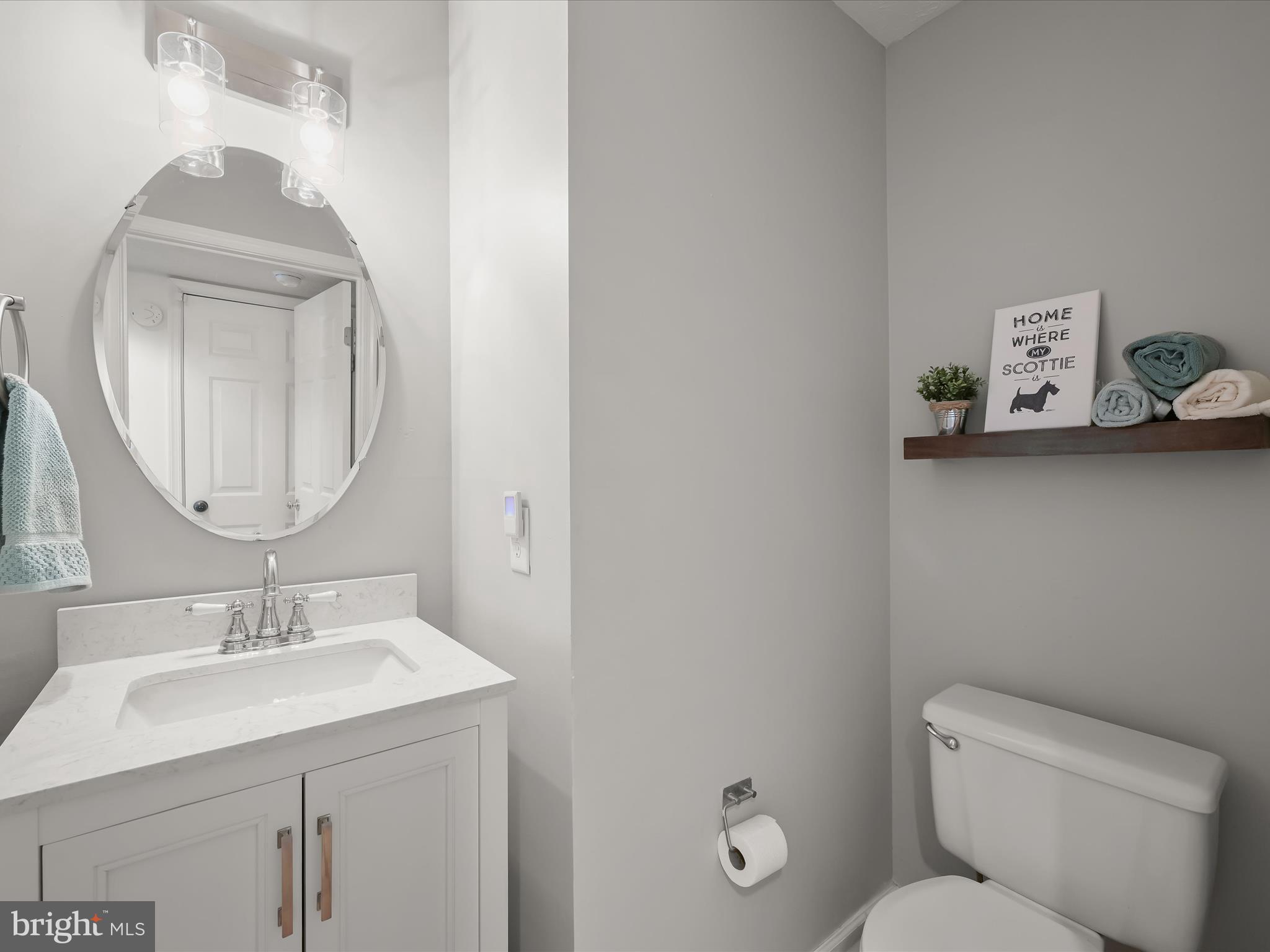 2333 Golden Chapel Road Odenton, MD 21113 - Photo 24 of 62 a bathroom with a toilet sink and mirror