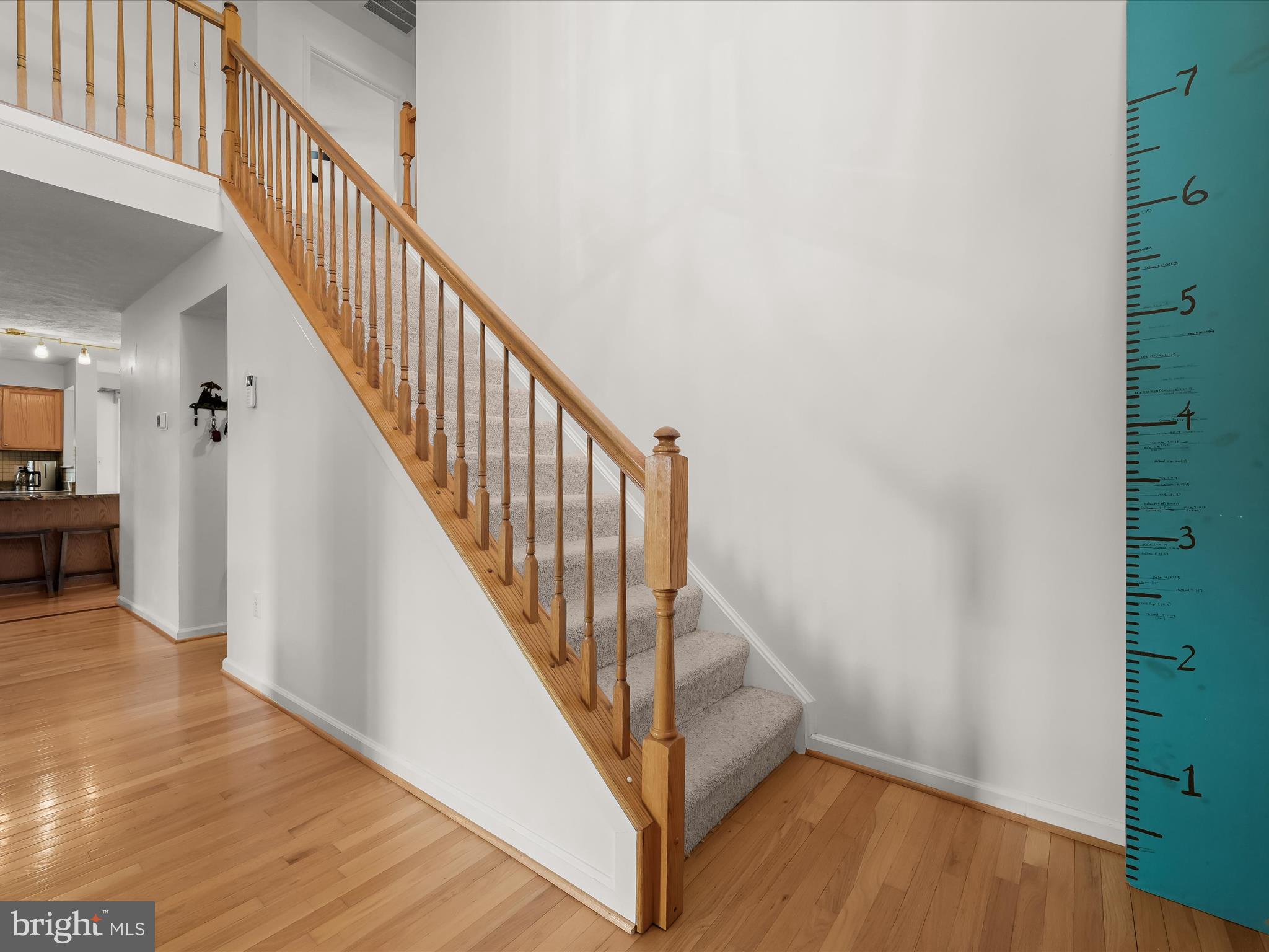 2333 Golden Chapel Road Odenton, MD 21113 - Photo 25 of 62 a view of a hallway with wooden floor and staircase