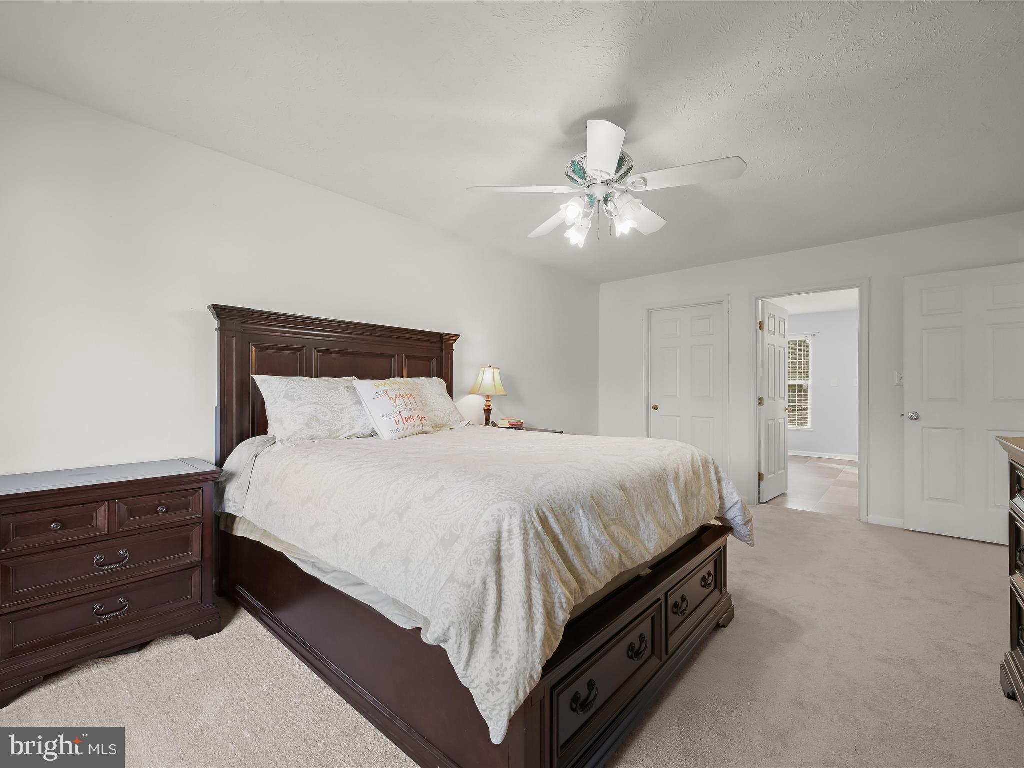 2333 Golden Chapel Road Odenton, MD 21113 - Photo 28 of 62 a bedroom with a bed and a ceiling fan