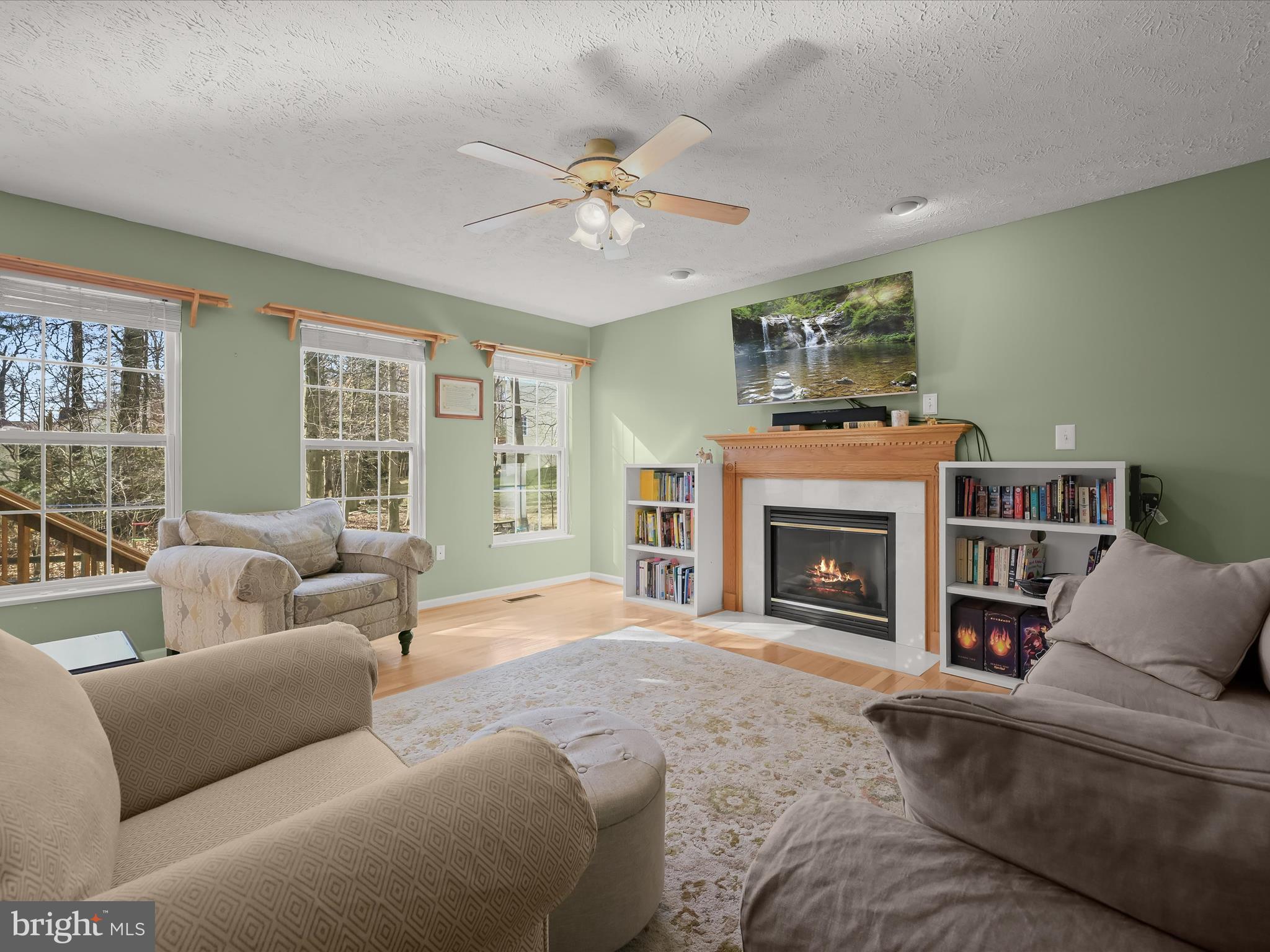2333 Golden Chapel Road Odenton, MD 21113 - Photo 2 of 62 a living room with furniture and a fireplace