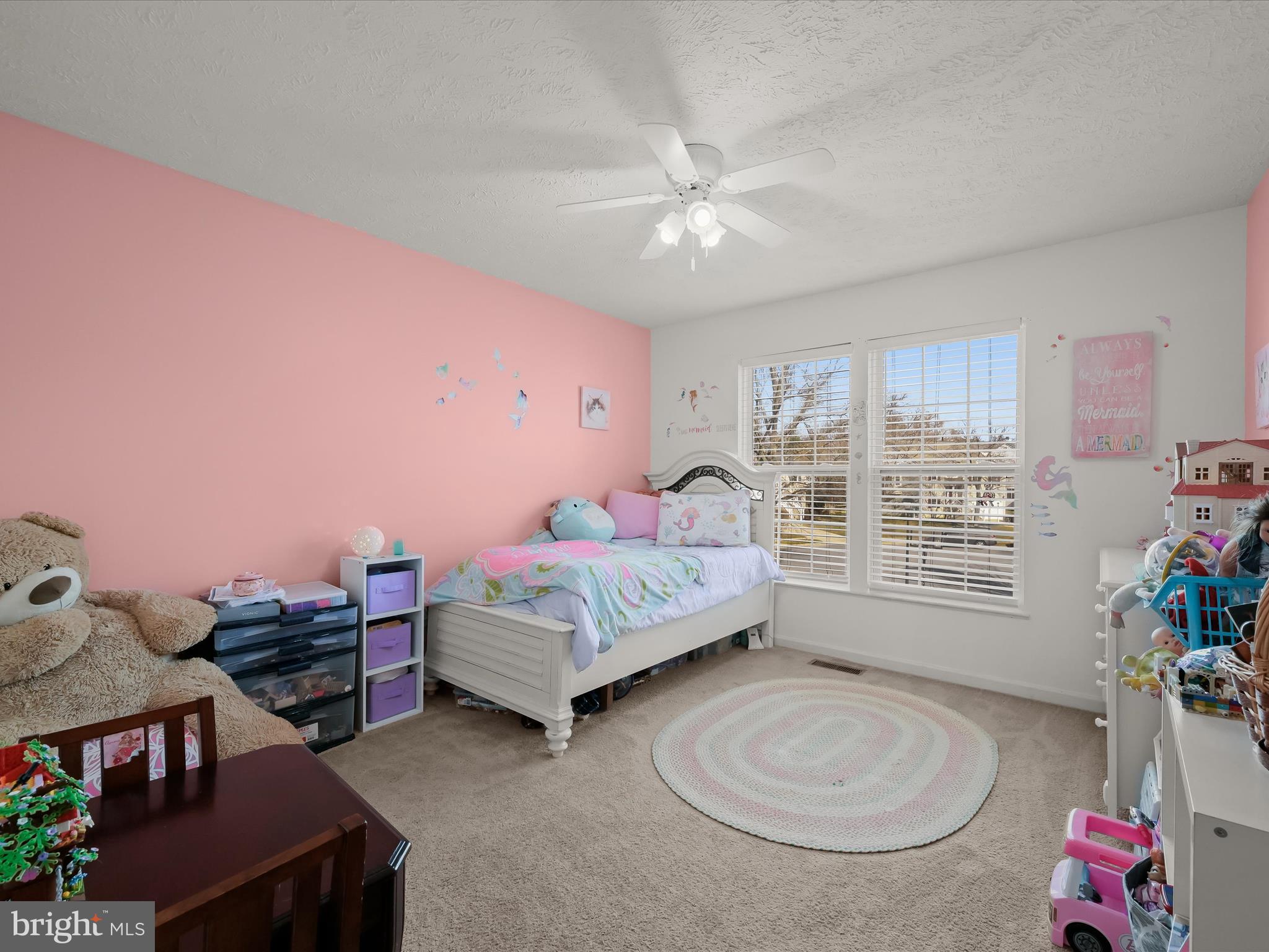 2333 Golden Chapel Road Odenton, MD 21113 - Photo 36 of 62 a bedroom with a bed and a chandelier