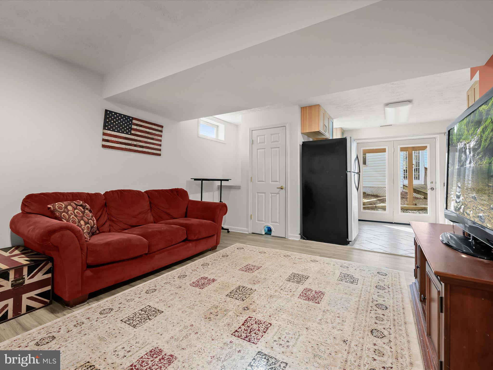 2333 Golden Chapel Road Odenton, MD 21113 - Photo 3 of 62 a living room with a couch and a dresser with wooden floor
