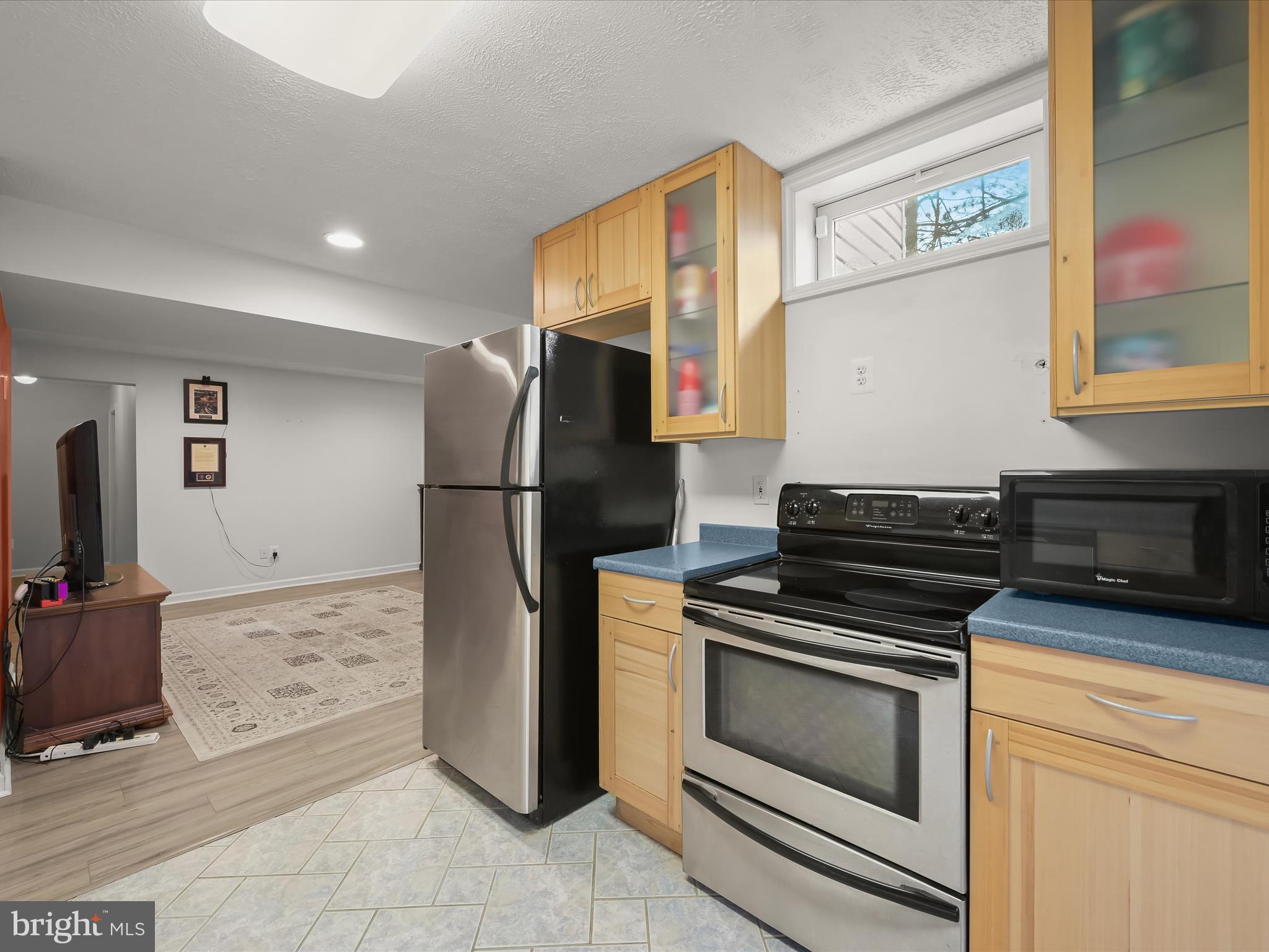 2333 Golden Chapel Road Odenton, MD 21113 - Photo 41 of 62 a kitchen with a refrigerator and a stove top oven