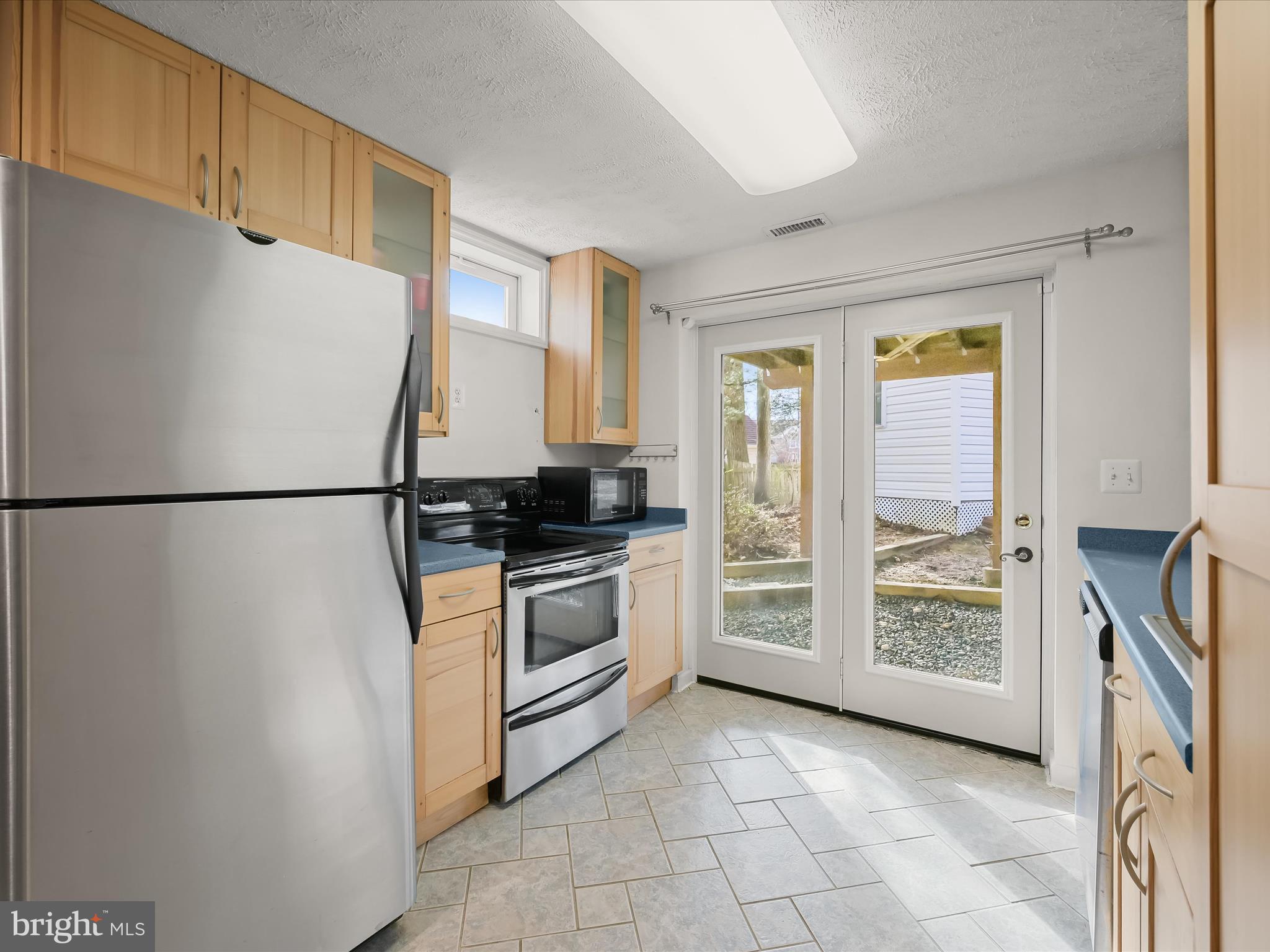2333 Golden Chapel Road Odenton, MD 21113 - Photo 42 of 62 a kitchen with stainless steel appliances granite countertop a refrigerator a cabinets and a sink