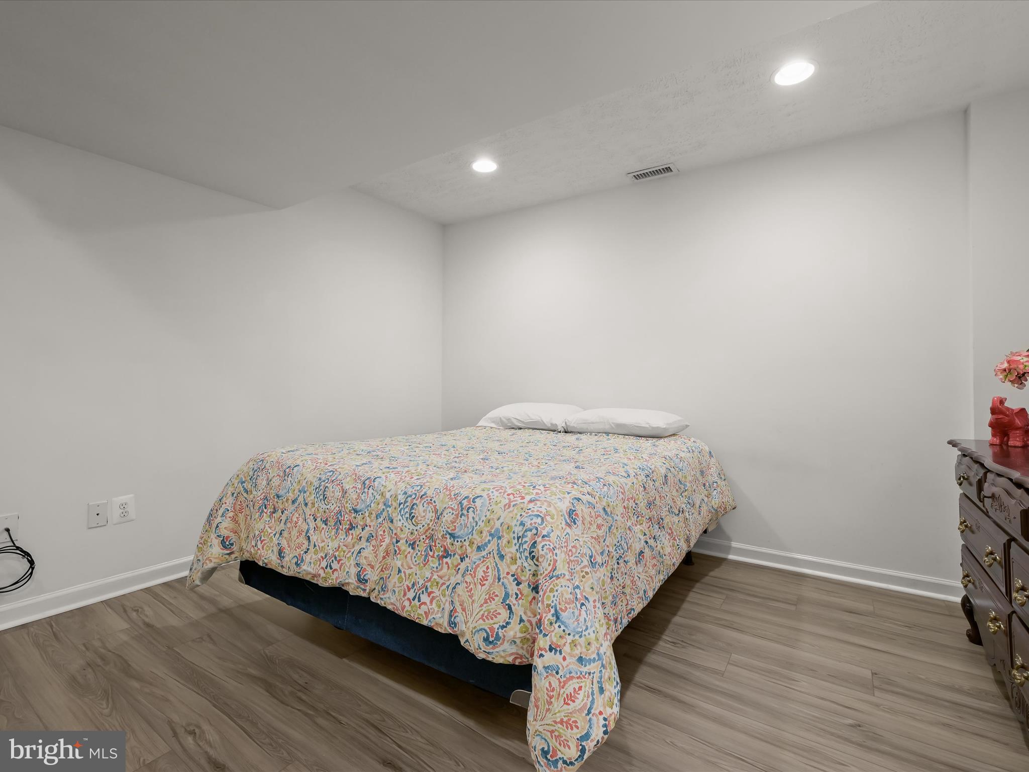 2333 Golden Chapel Road Odenton, MD 21113 - Photo 44 of 62 a large bed sitting in a room next to a lamp