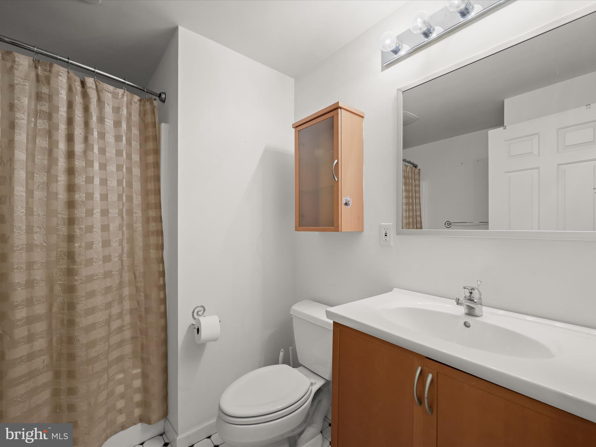 2333 Golden Chapel Road Odenton, MD 21113 - Photo 48 of 62 a bathroom with a sink a toilet and shower