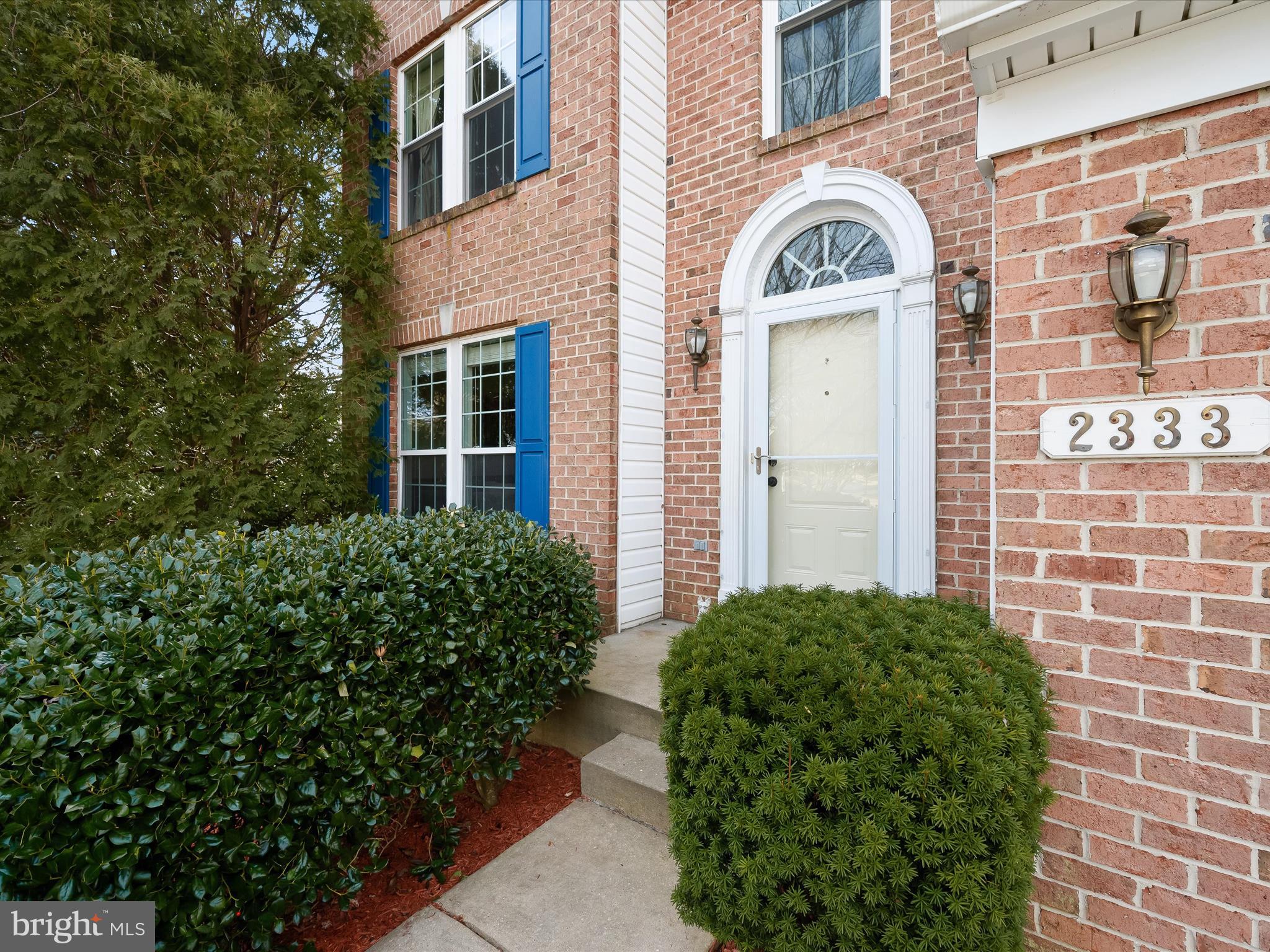 2333 Golden Chapel Road Odenton, MD 21113 - Photo 7 of 62 a view of a brick house with a flower garden