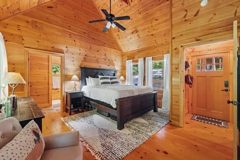 a bathroom with a tub shower and sink