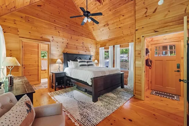 a bathroom with a tub shower and sink