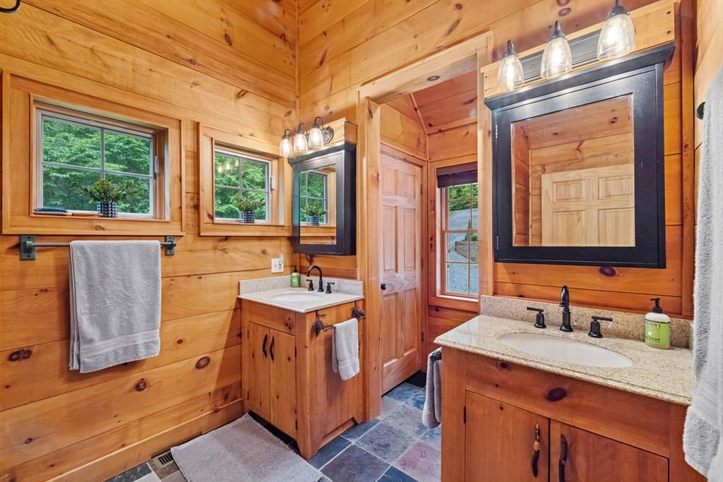 80 Tall Pines Road Morganton, GA 30560 - Photo 17 of 49 a bathroom with a granite countertop sink mirror and a bathtub