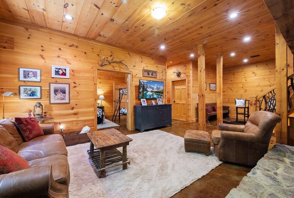 80 Tall Pines Road Morganton, GA 30560 - Photo 20 of 49 a living room with furniture and a flat screen tv