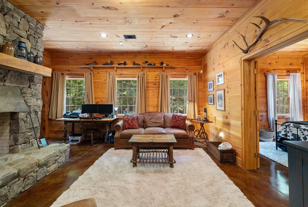 80 Tall Pines Road Morganton, GA 30560 - Photo 22 of 49 a living room with furniture and a fireplace