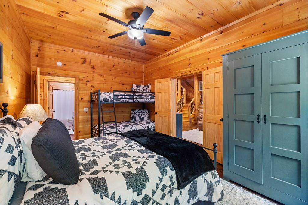 80 Tall Pines Road Morganton, GA 30560 - Photo 25 of 49 a bedroom with a bed and a chandelier