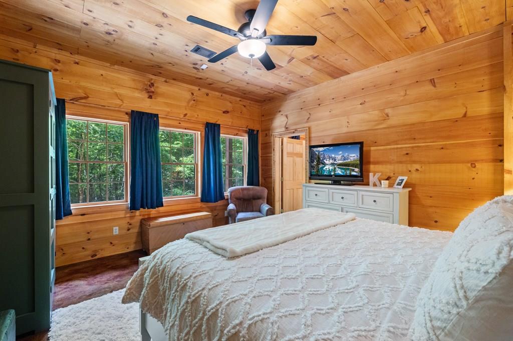 80 Tall Pines Road Morganton, GA 30560 - Photo 28 of 49 a bedroom with a bed and large windows