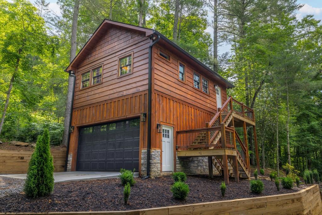80 Tall Pines Road Morganton, GA 30560 - Photo 31 of 49 a front view of a house with garden