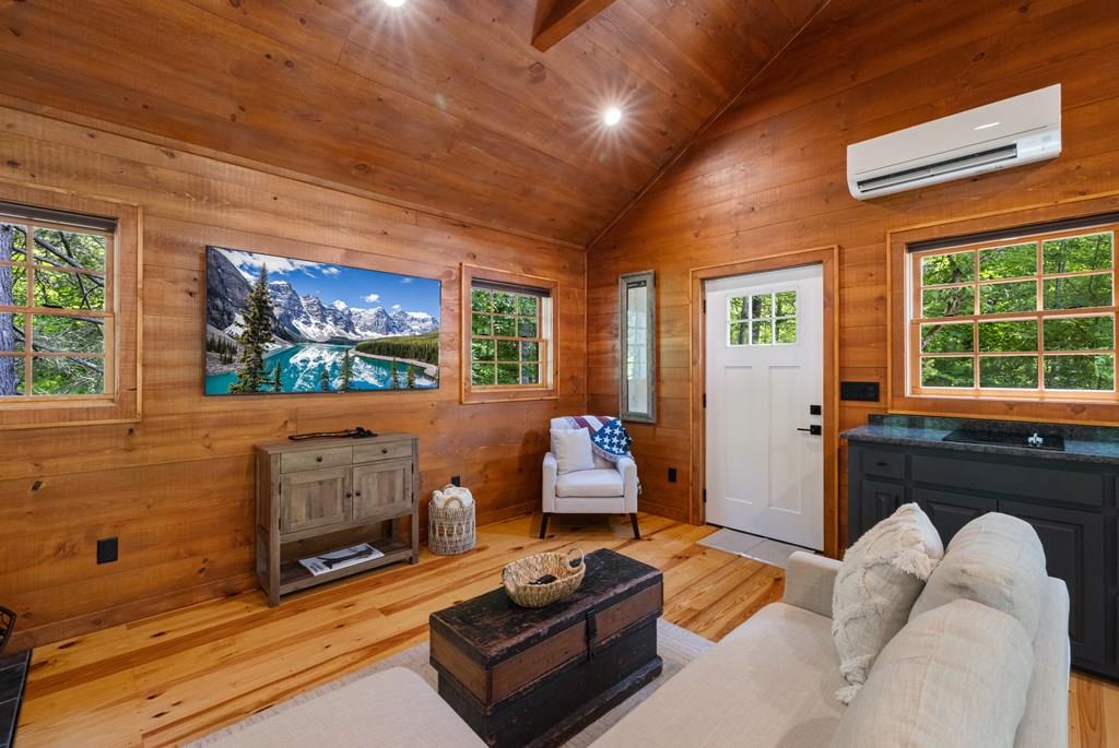 80 Tall Pines Road Morganton, GA 30560 - Photo 37 of 49 a living room with furniture a flat screen tv and a fireplace