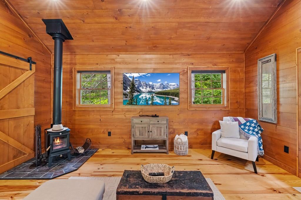 80 Tall Pines Road Morganton, GA 30560 - Photo 38 of 49 a living room with furniture and a painting on the wall