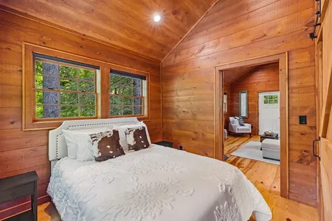 a bathroom with sink shower and mirror