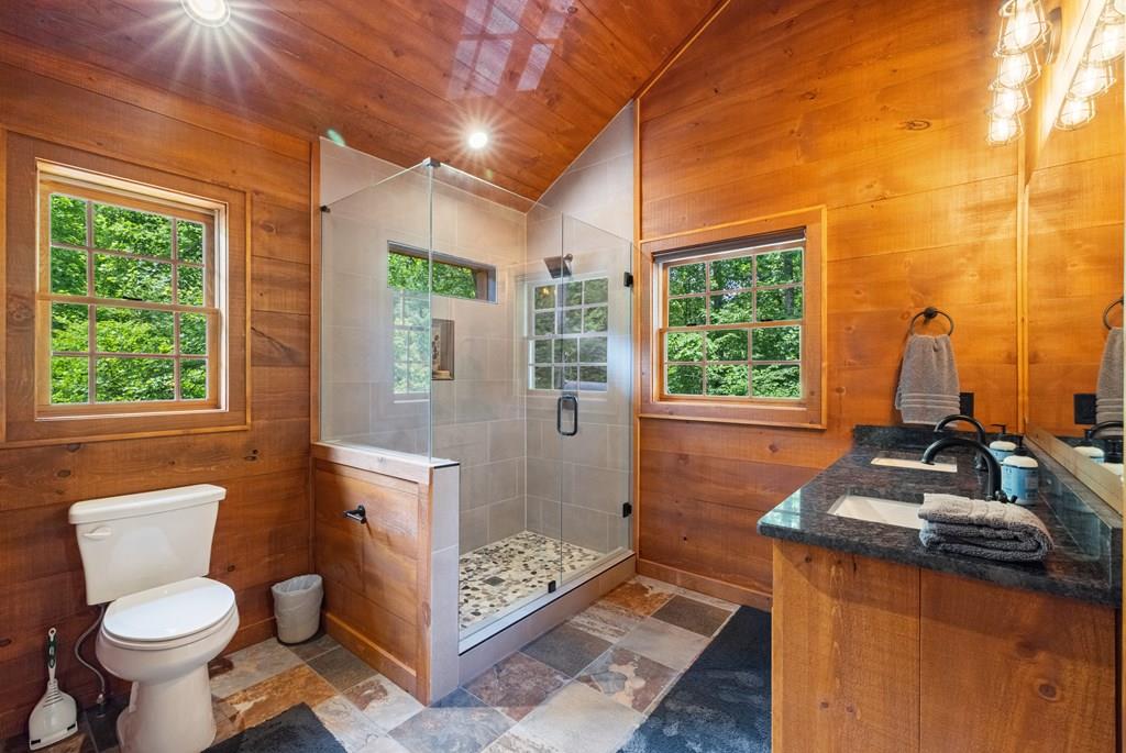 80 Tall Pines Road Morganton, GA 30560 - Photo 40 of 49 a bathroom with a toilet sink and mirror