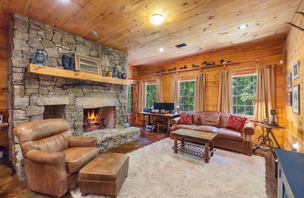 80 Tall Pines Road Morganton, GA 30560 - Photo 6 of 49 a living room with furniture and a fireplace