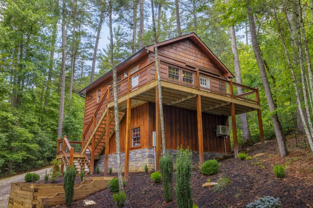 80 Tall Pines Road Morganton, GA 30560 - Photo 8 of 49 a front view of a house with garden