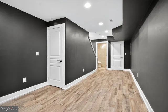 a bathroom with a sink mirror and toilet