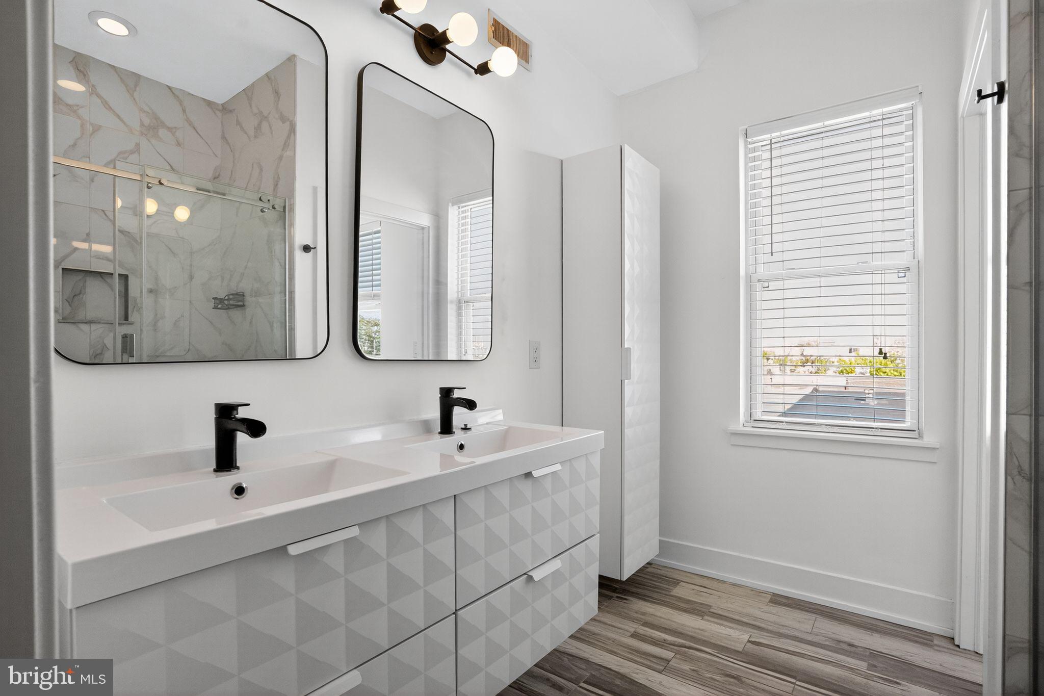 419 Emily Street Philadelphia, PA 19148 - Photo 21 of 34 a bathroom with a sink and a mirror