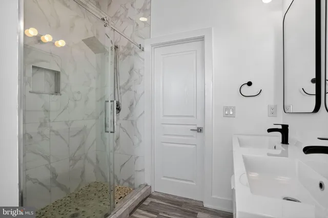 a view of an empty room and wooden floor