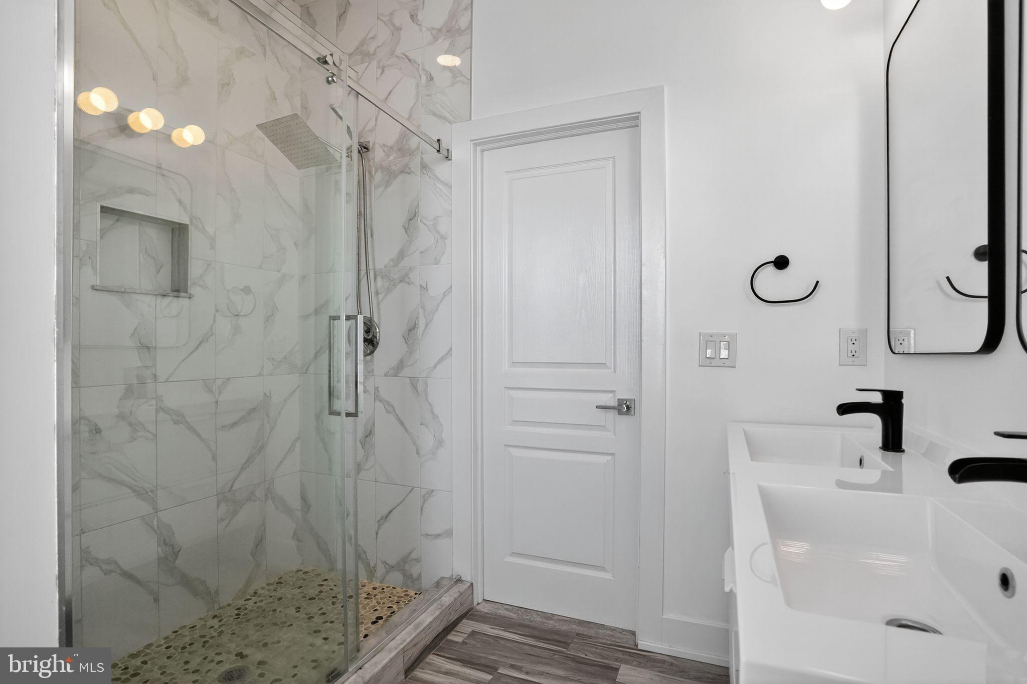 419 Emily Street Philadelphia, PA 19148 - Photo 22 of 34 a bathroom with a sink a toilet and shower