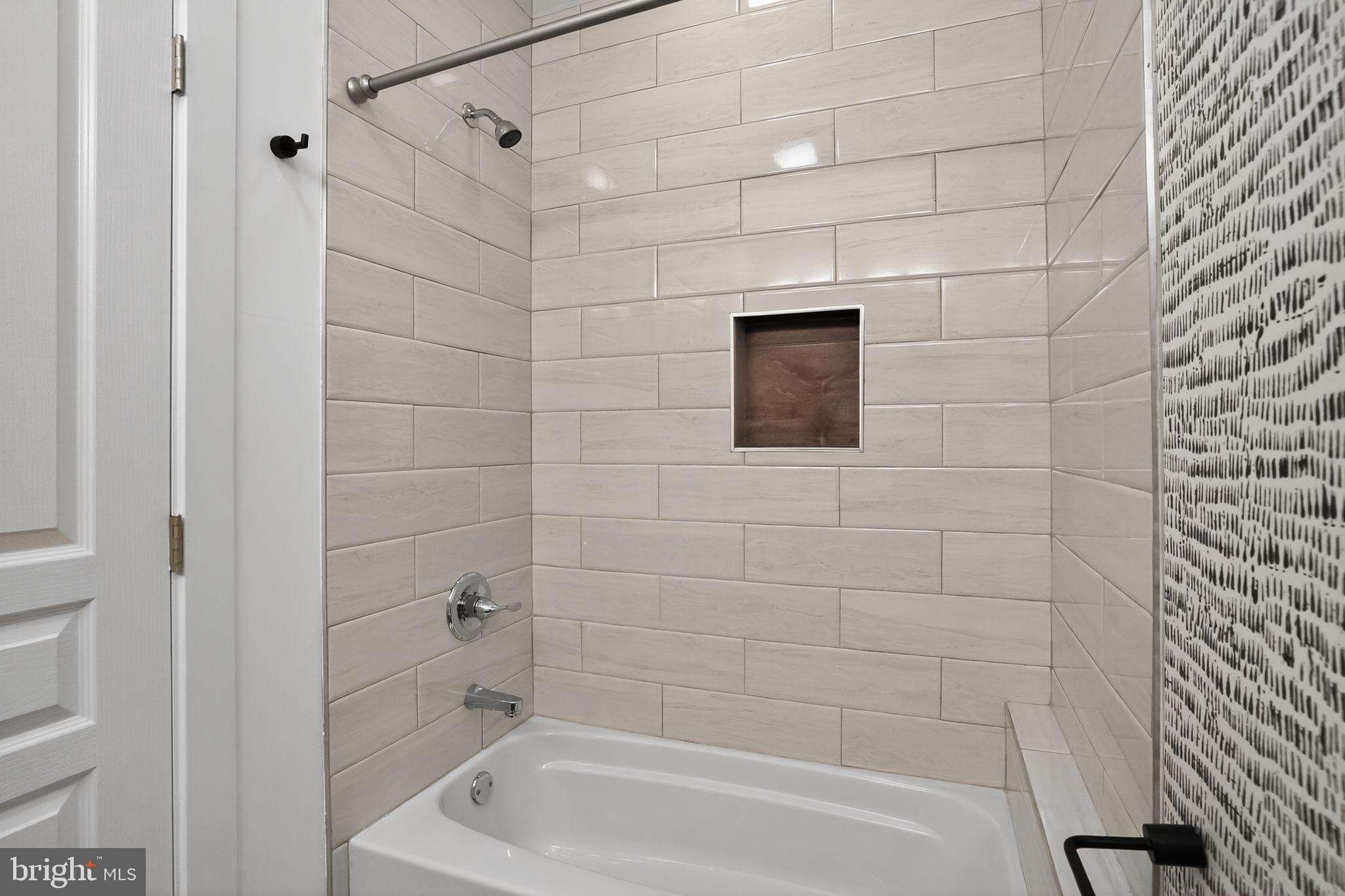 419 Emily Street Philadelphia, PA 19148 - Photo 27 of 34 a bathroom with a shower and a bathtub