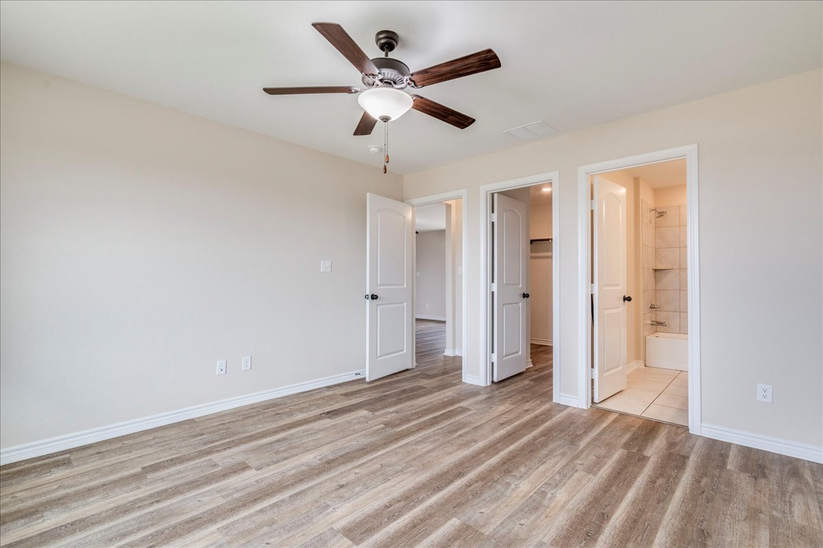 1092 Engelke Road Niederwald, TX 78640 - Photo 12 of 24 an empty room with closet and ceiling fan