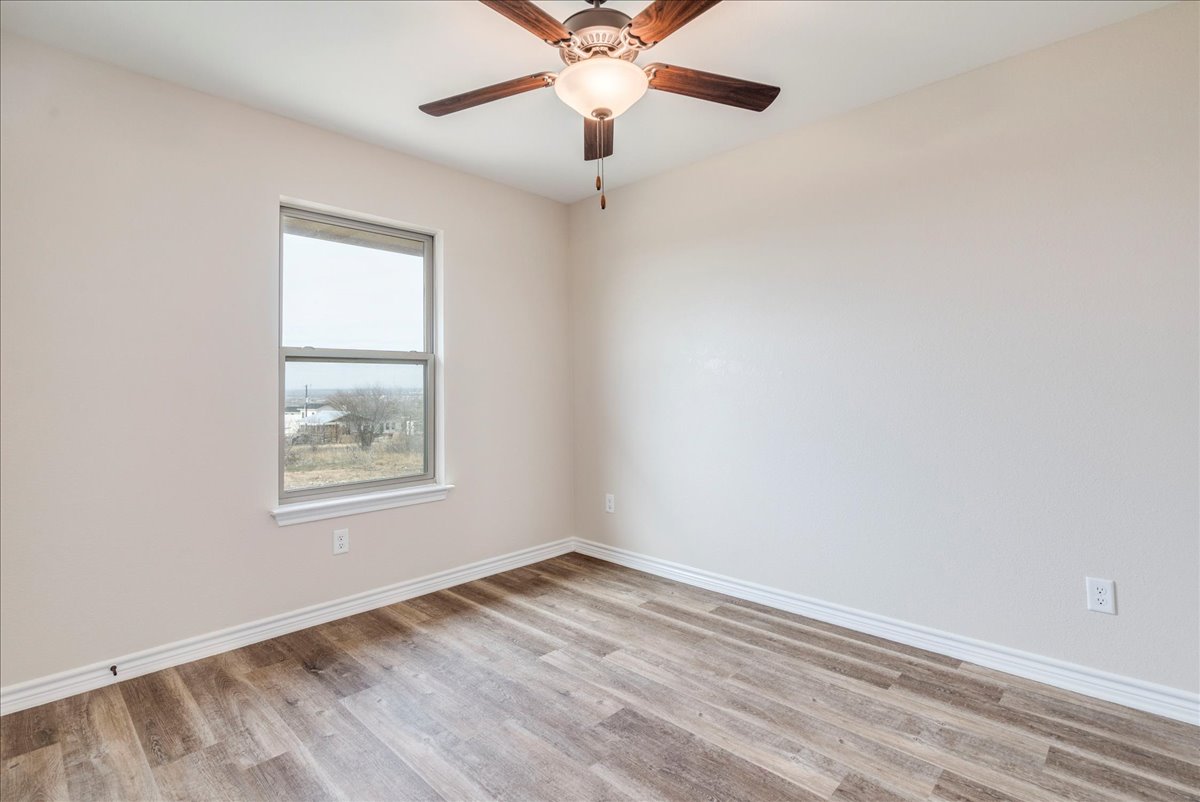 1092 Engelke Road Niederwald, TX 78640 - Photo 17 of 24 an empty room with a window and a fan