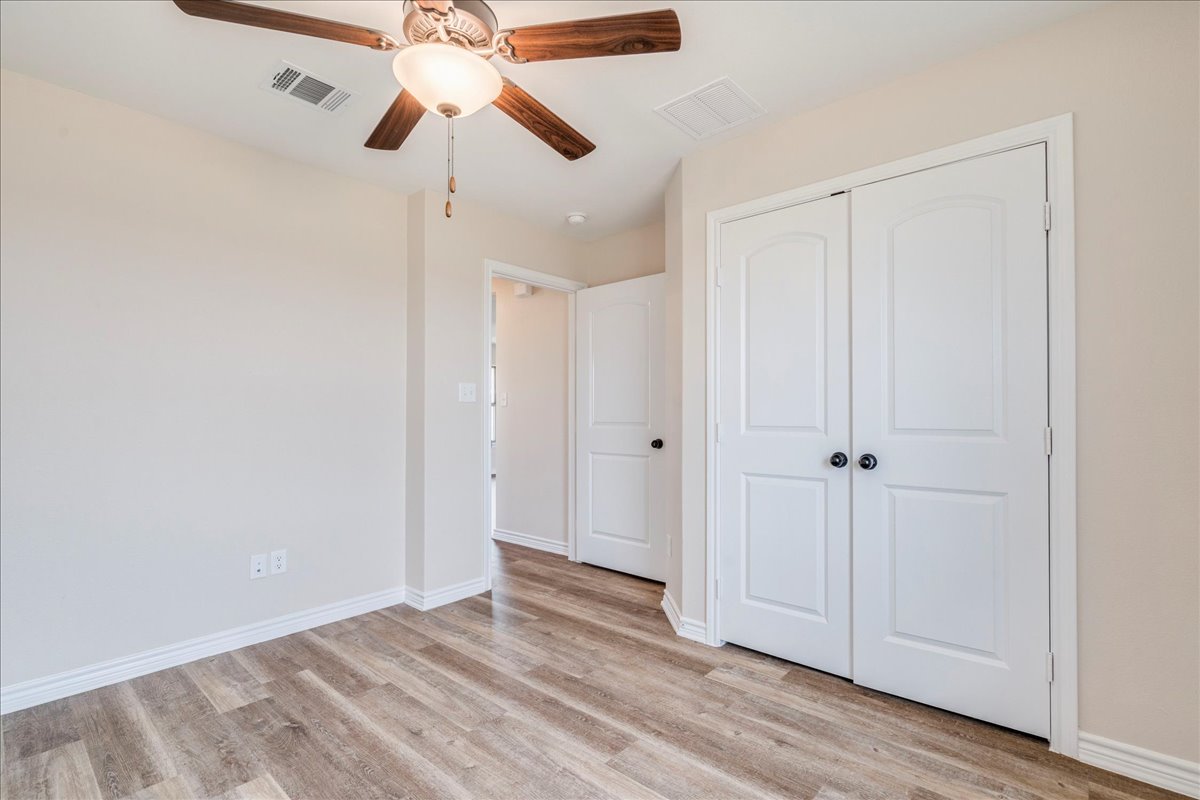 1092 Engelke Road Niederwald, TX 78640 - Photo 18 of 24 a view of empty room with wooden floor