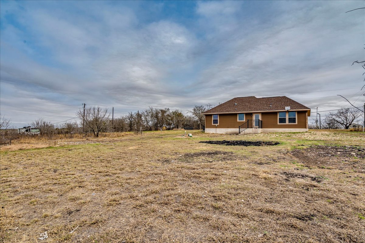 1092 Engelke Road Niederwald, TX 78640 - Photo 23 of 24 a front view of a house with a yard