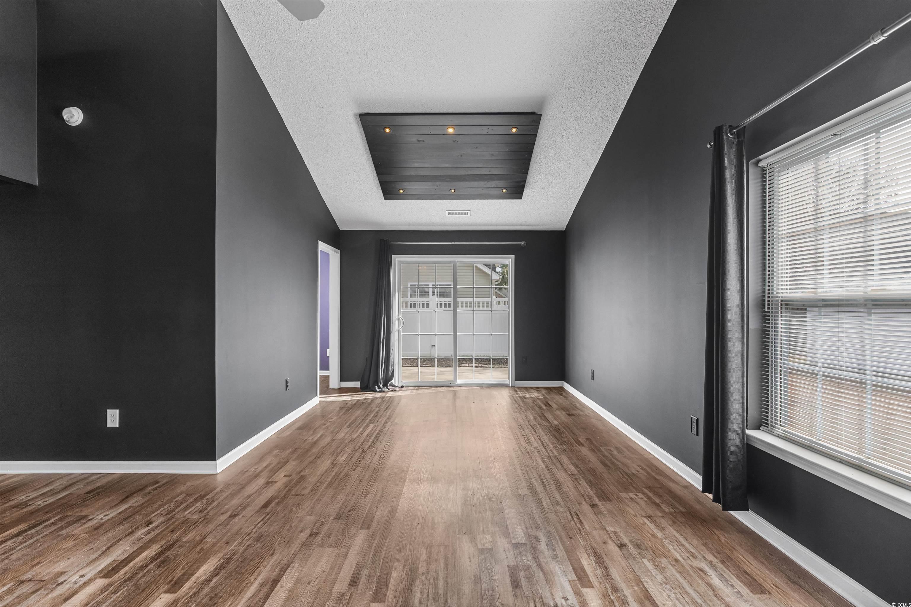 5029 Capulet Circle Myrtle Beach, SC 29588 - Photo 10 of 22 Spare room with wood finished floors, cooling unit, and a textured ceiling