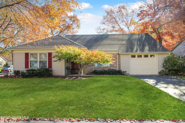 a view of a house with a backyard
