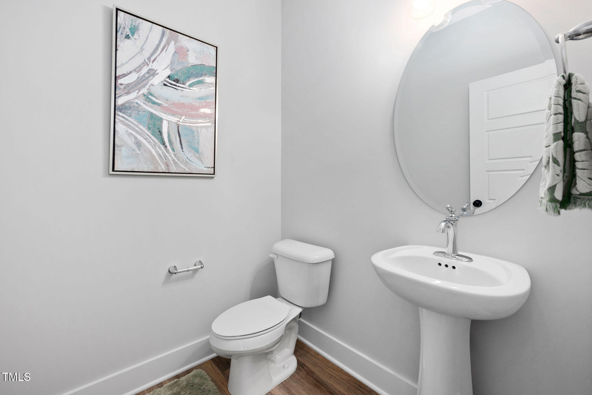 50 Southern Village Drive Roxboro, NC 27573 - Photo 12 of 32 a bathroom with a toilet a sink and mirror