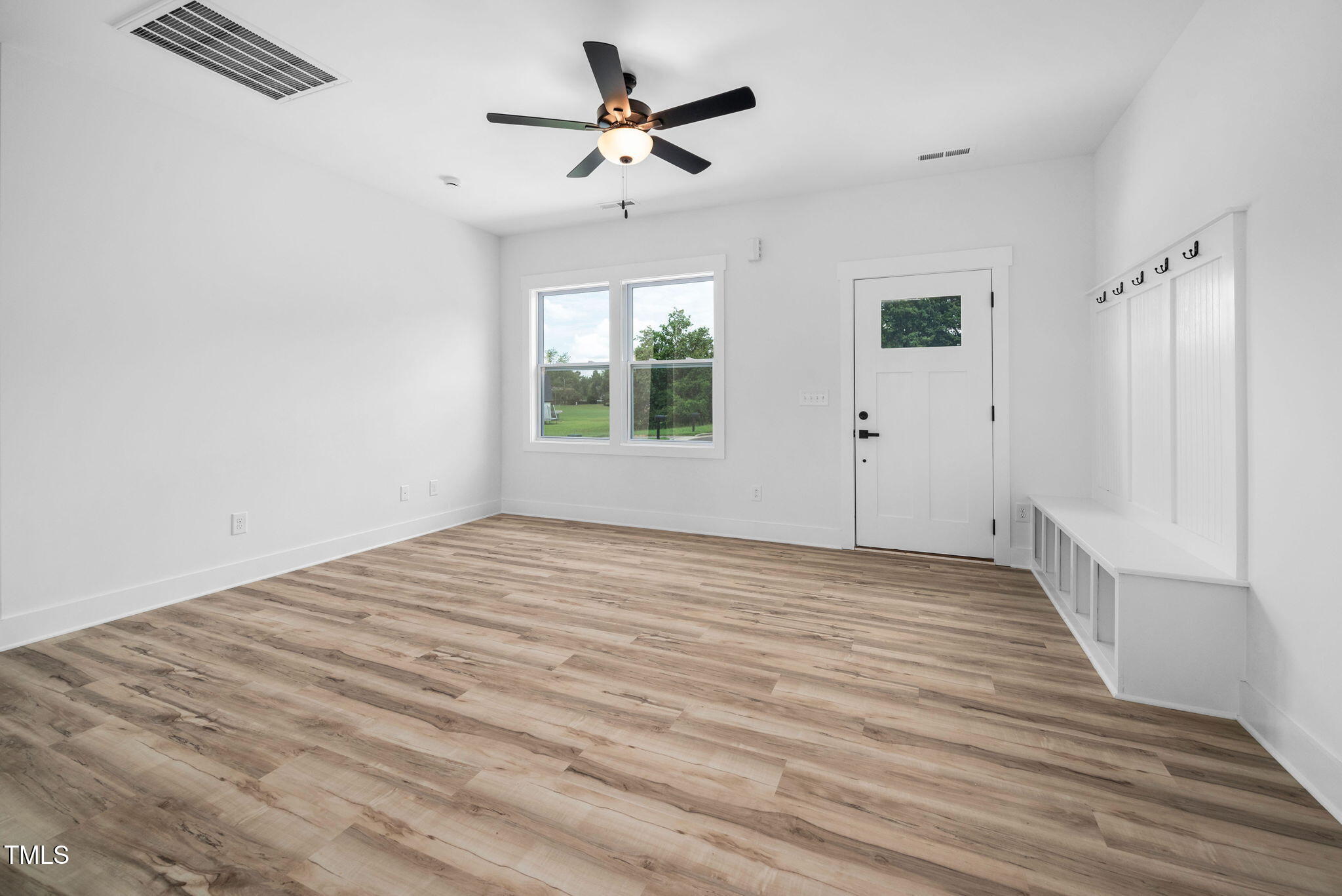50 Southern Village Drive Roxboro, NC 27573 - Photo 19 of 32 wooden floor in an empty room with a window