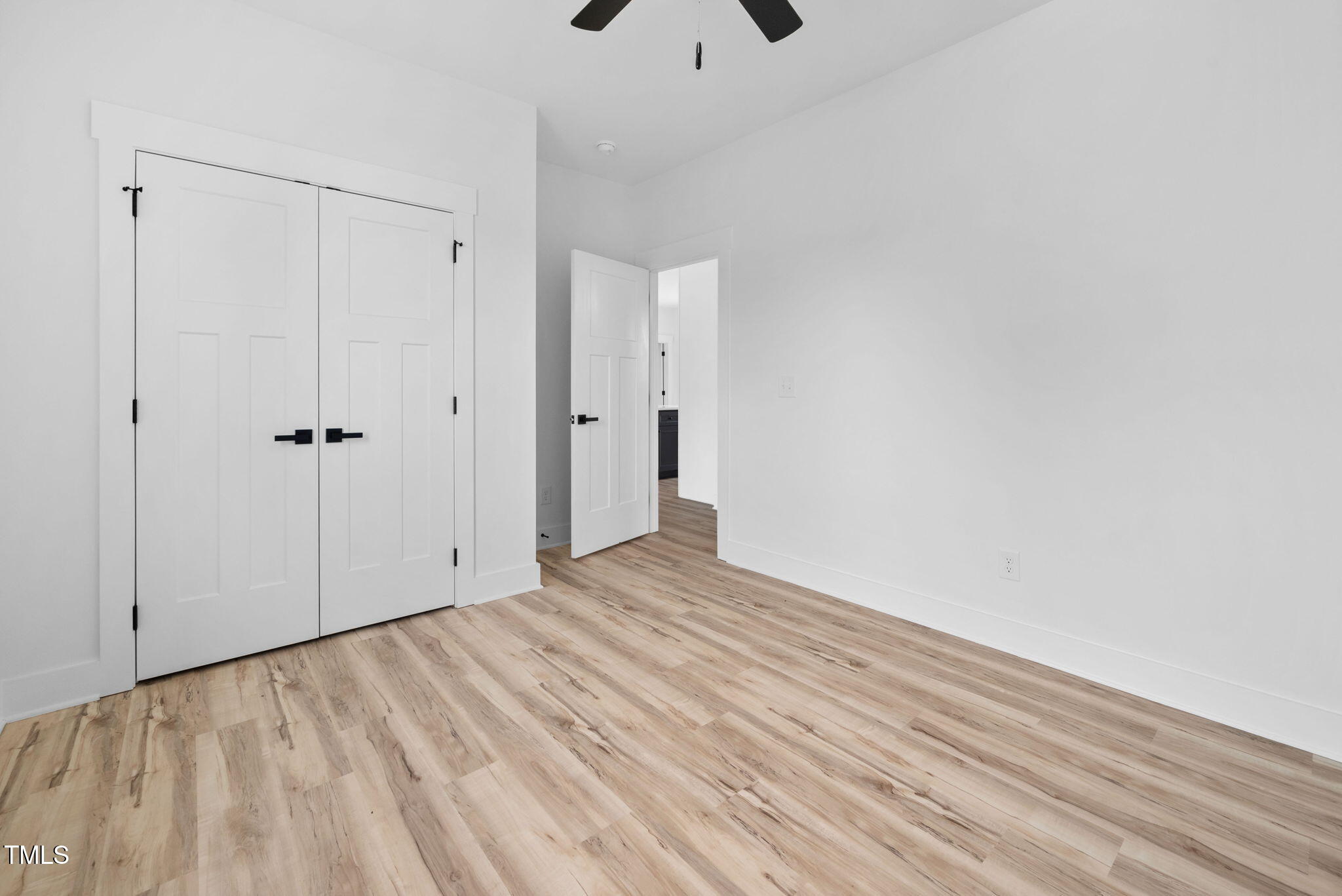 50 Southern Village Drive Roxboro, NC 27573 - Photo 30 of 32 a view of an empty room with wooden floor