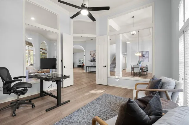 a view of a dining room with furniture and wooden floor
