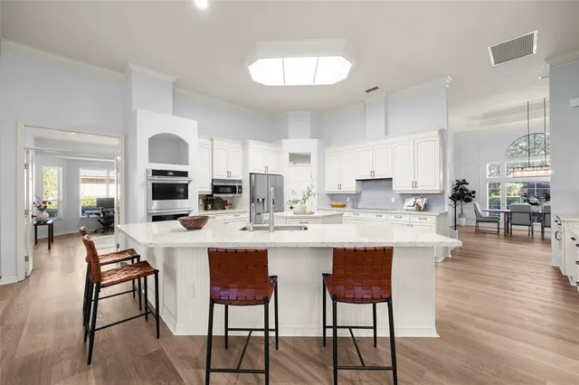 a living room with furniture fireplace and a large window