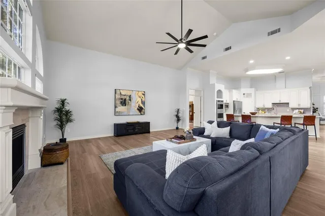 a spacious bedroom with a bed and a large window