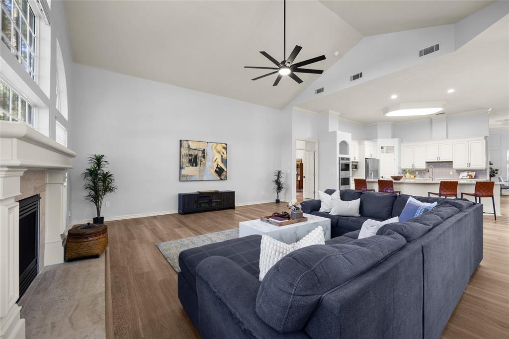 4606 Southwest 97th Terrace Gainesville, FL 32608 - Photo 25 of 68 a living room with furniture and a fireplace