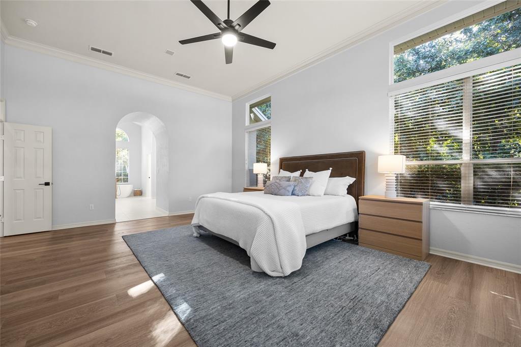 4606 Southwest 97th Terrace Gainesville, FL 32608 - Photo 28 of 68 a spacious bedroom with a bed and a large window
