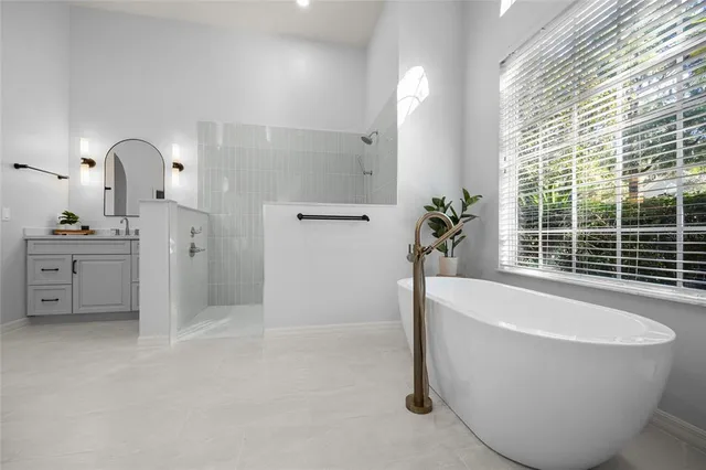 a bathroom with a double vanity sink mirror and toilet
