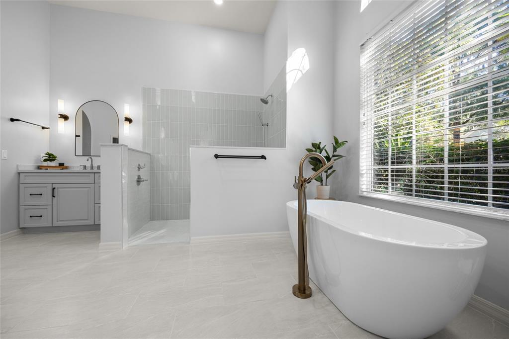 4606 Southwest 97th Terrace Gainesville, FL 32608 - Photo 33 of 68 a white bath tub sitting in a bathroom next to a window